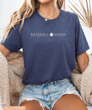 Person wearing heather navy Bella Canvas t-shirt with 'BASEBALL MAMA' text.