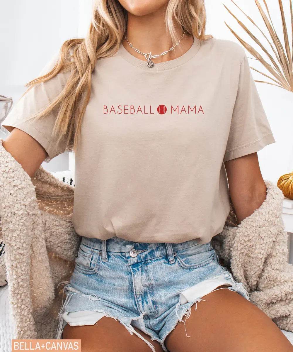 Person wearing tan Bella Canvas t-shirt with 'BASEBALL MAMA' text.