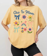 She Is Mom Comfort Colors® T-Shirt – Floral & Bow Inspirational Mom Shirt - Woven Mama