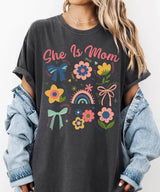 She Is Mom Comfort Colors® T-Shirt – Floral & Bow Inspirational Mom Shirt - Woven Mama