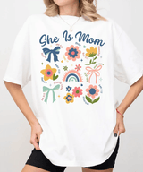 She Is Mom Comfort Colors® T-Shirt – Floral & Bow Inspirational Mom Shirt - Woven Mama