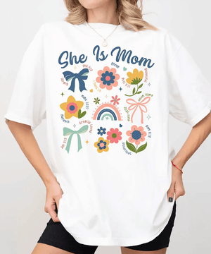 She Is Mom Comfort Colors® T-Shirt – Floral & Bow Inspirational Mom Shirt - Woven Mama