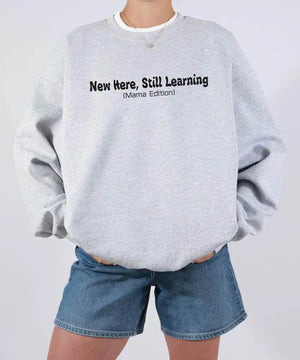 New Here Still Learning Mama Edition Shirt – New Mom Comfort Colors® Tee or Sweatshirt - Woven Mama